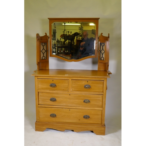 1090 - A Victorian satinwood dressing table, the upper section with mirror flanked by glazed cabinets, the ... 