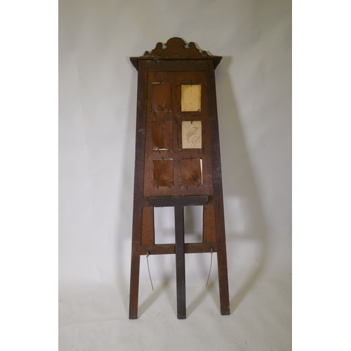 1093 - A Victorian oak easel photo frame, 152cm high