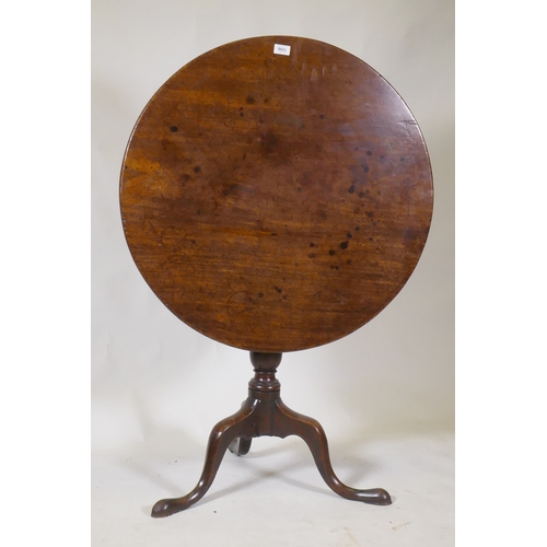 1096 - Georgian mahogany tilt top table, raised on a turned column and tripod supports with pad feet, 78cm ... 