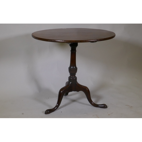 1096 - Georgian mahogany tilt top table, raised on a turned column and tripod supports with pad feet, 78cm ... 