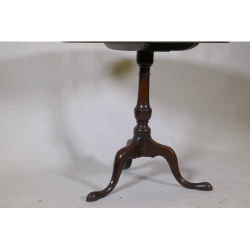 1096 - Georgian mahogany tilt top table, raised on a turned column and tripod supports with pad feet, 78cm ... 