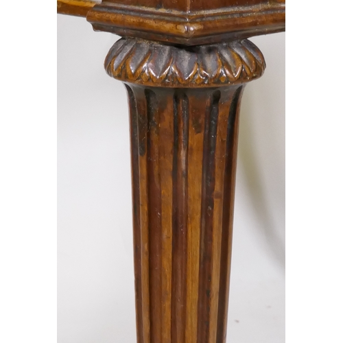 1097 - A Georgian mahogany fold over tea table, with single drawer and swan neck handles, raised on fluted ... 