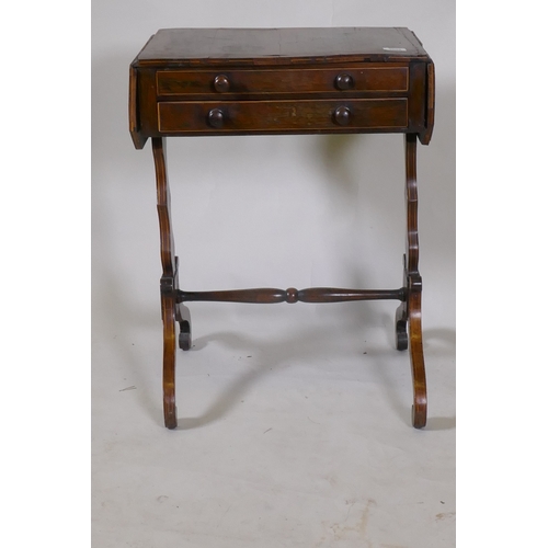 1098 - A Georgian rosewood work table with drop flaps and two drawers, raised on shaped end supports united... 