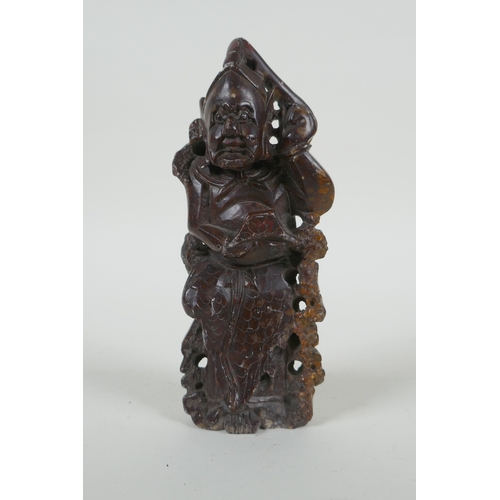 110 - A Chinese carved soapstone figure, 15cm high