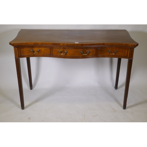 1100 - A Georgian inlaid mahogany serpentine front serving table, with single drawer and two fake, raised o... 