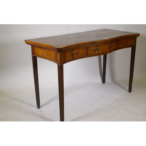 1100 - A Georgian inlaid mahogany serpentine front serving table, with single drawer and two fake, raised o... 