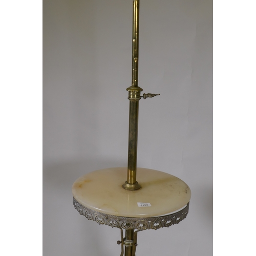 1102 - A brass and alabaster standard lamp with telescope action, 150cm extended