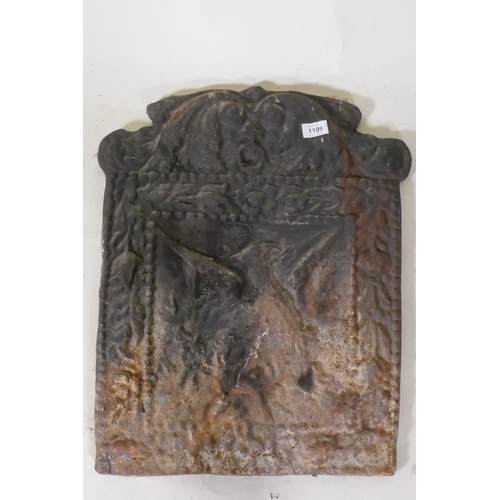 1109 - A cast iron fire back with raised decoration of a phoenix rising from the flames, 44 x 58cm