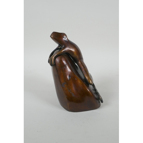 111 - After Phil Vanderlei (American), a bronze figure of a frog on a rock, 15cm high