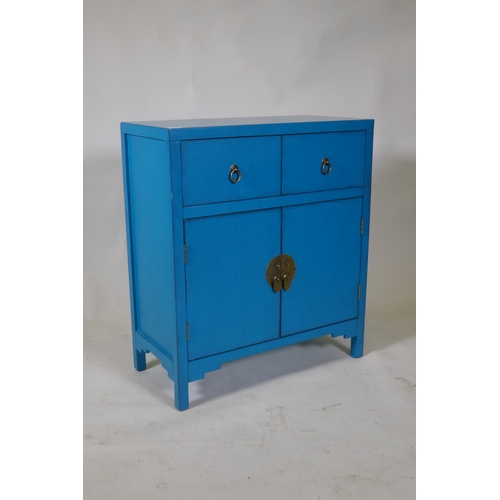 1110 - A contemporary oriental style lacquered cabinet with two drawers over two cupboards, 66 x 32 x 76cm