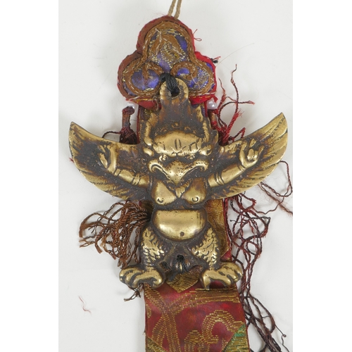 112 - A Tibetan brass Garuda pendant/totem, 23 x 10cm