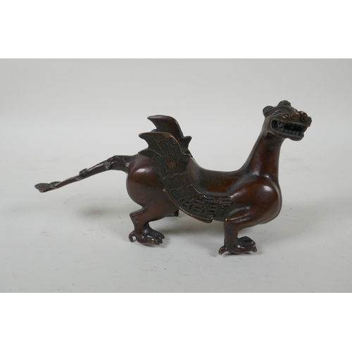 113 - A Japanese filled bronze stylised dragon, 21cm long, indistinct 6 character mark to base