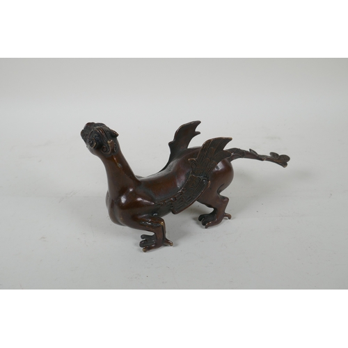 113 - A Japanese filled bronze stylised dragon, 21cm long, indistinct 6 character mark to base