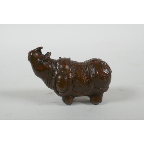 115 - A Japanese style bronze okimono rhinoceros, 6.5cm long