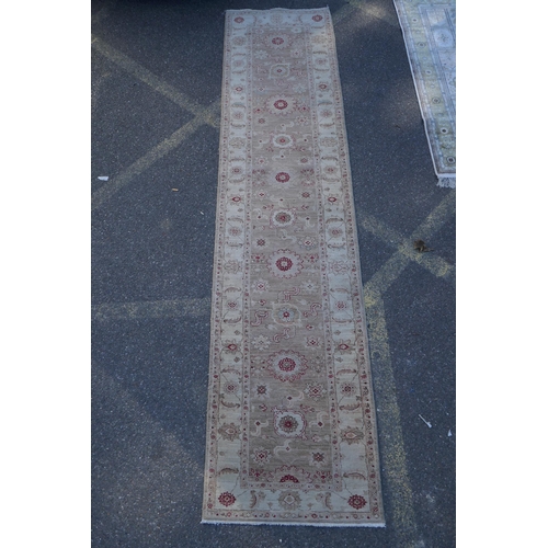 1158 - A cream ground wool Ziegler Mahal runner decorated with floral medallions, 85 x 350cm