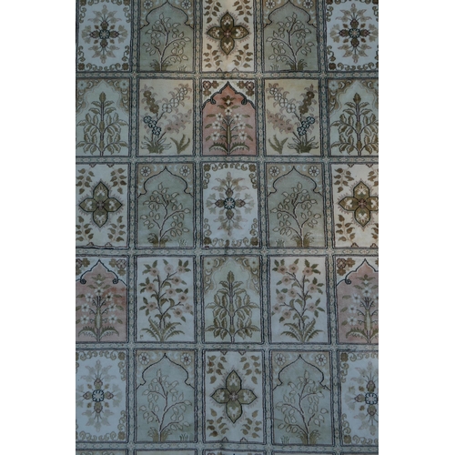 1159 - An ivory ground silk Kashan rug with panelled garden design, signed, 126 x 184cm