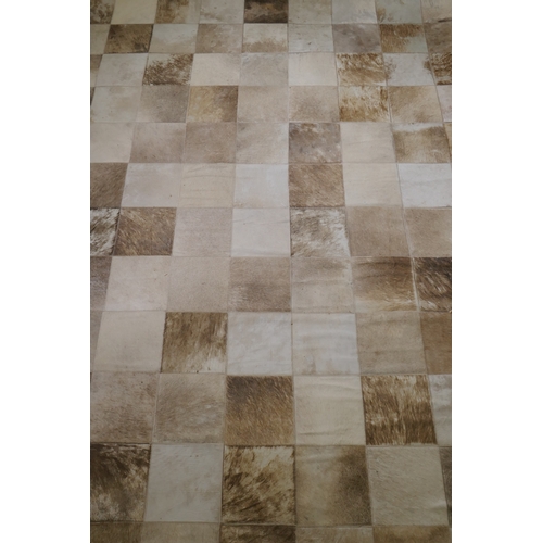 1163 - A John Lewis cowhide tile carpet, 240 x 170cm