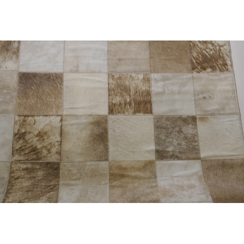 1163 - A John Lewis cowhide tile carpet, 240 x 170cm