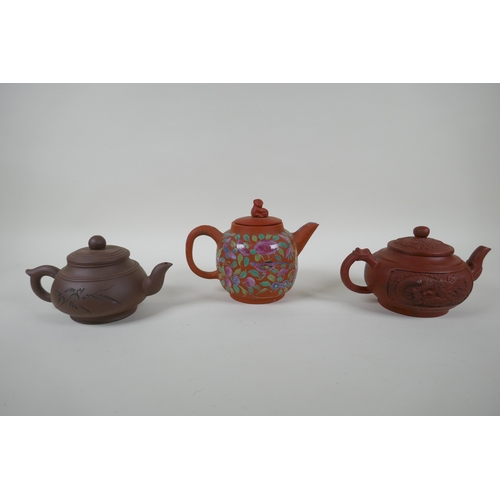 120 - Three Chinese YiXing teapots, one with famille rose enamelled floral decoration, AF, largest 13cm hi... 