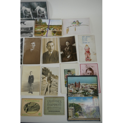 129 - A quantity of early C20th and later postcards, and snapshot albums, mostly topographical, largest 17... 