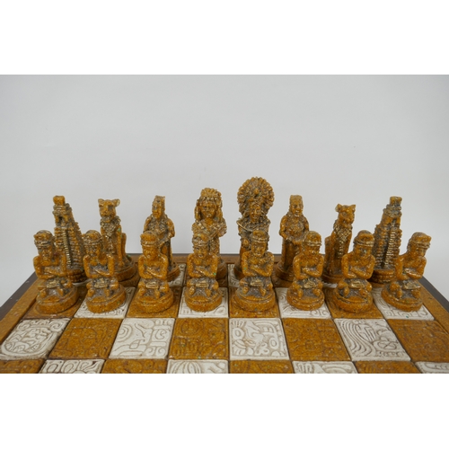 133 - A composition chess set in the form of Myan deities, complete, 40 x 40cm