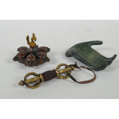 136 - An Indian bronze six section tikka pot, a filled bronze Buddha's hand, and a Tibetan bronze vajra, l... 