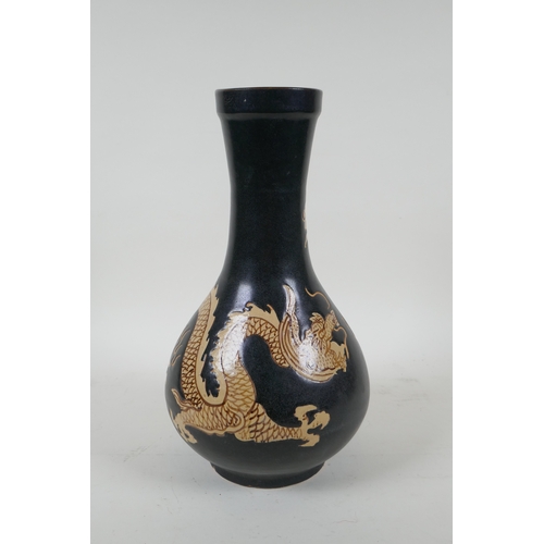 138 - A Chinese Cizhou kiln bottle vase with dragon decoration, 29cm high