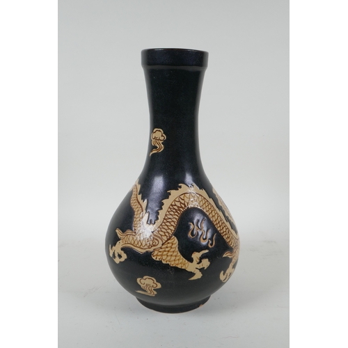 138 - A Chinese Cizhou kiln bottle vase with dragon decoration, 29cm high