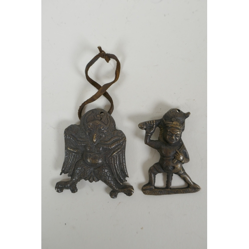 139 - A Tibetan moulded metal Garuda pendant and another of a wrathful deity, 6 x 6cm