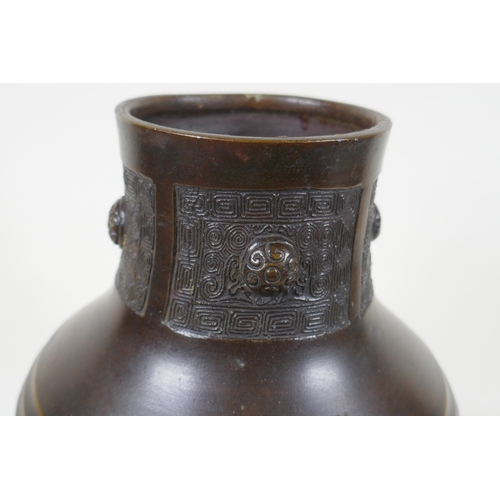 148 - A Chinese bronze vase with archaic style decoration, 30cm high