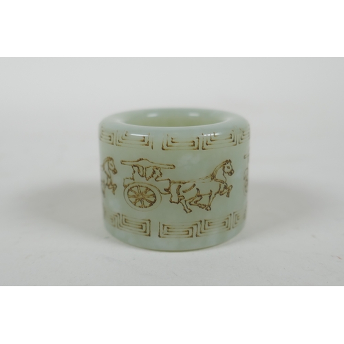 156 - A Chinese mottled celadon jade archers thumb ring, with horse and cart decoration, 2cm diameter inte... 