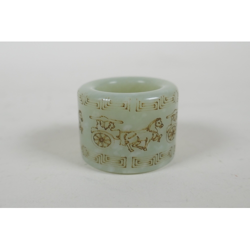 156 - A Chinese mottled celadon jade archers thumb ring, with horse and cart decoration, 2cm diameter inte... 