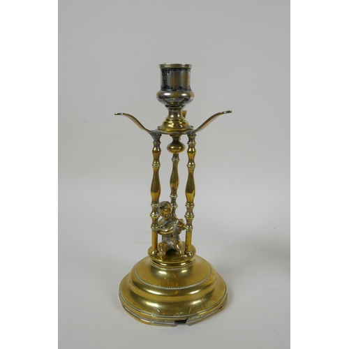 159 - An antique brass candle stick with putto decoration, together with an Art Nouveau style bronzed cast... 