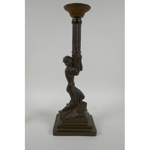 159 - An antique brass candle stick with putto decoration, together with an Art Nouveau style bronzed cast... 