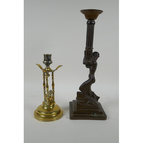 159 - An antique brass candle stick with putto decoration, together with an Art Nouveau style bronzed cast... 