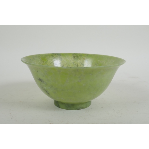 16 - A Chinese marbled green jade rice bowl, 13cm diameter