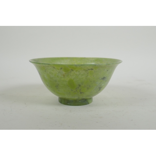 16 - A Chinese marbled green jade rice bowl, 13cm diameter