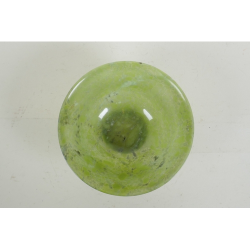 16 - A Chinese marbled green jade rice bowl, 13cm diameter