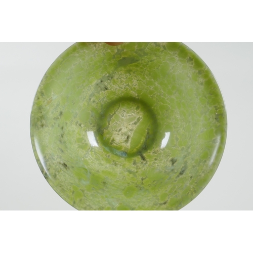 16 - A Chinese marbled green jade rice bowl, 13cm diameter