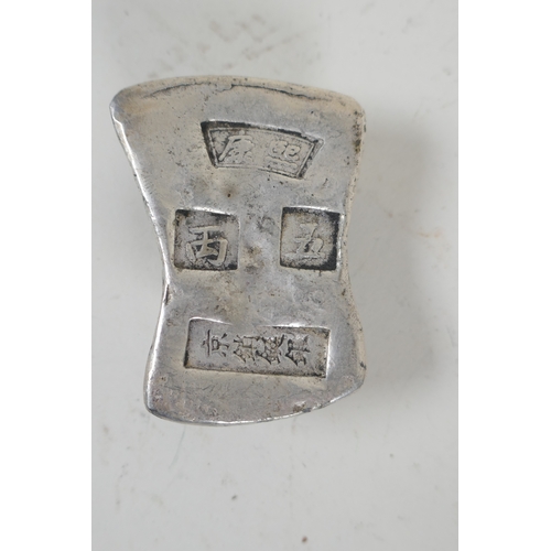 167 - A Chinese white metal trade token/ingot, and another smaller, 10 x 8cm