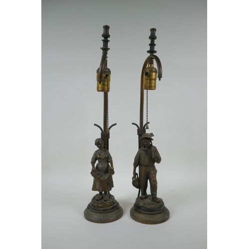 17 - A pair of Dutch gilt bronze figural table lamps of farm workers, after Joseph D'Aste, (1881-1945), 4... 