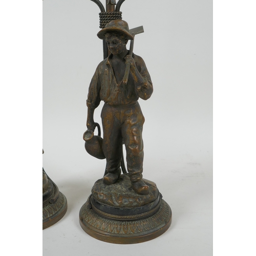 17 - A pair of Dutch gilt bronze figural table lamps of farm workers, after Joseph D'Aste, (1881-1945), 4... 