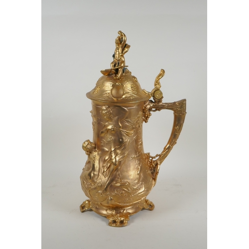 171 - A large secessionist style ormolu tankard decorated with nymphs, putti and fauns, 41cm high