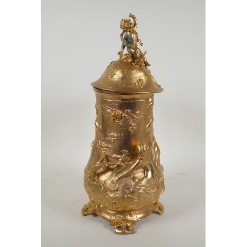 171 - A large secessionist style ormolu tankard decorated with nymphs, putti and fauns, 41cm high