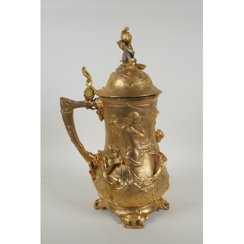 171 - A large secessionist style ormolu tankard decorated with nymphs, putti and fauns, 41cm high