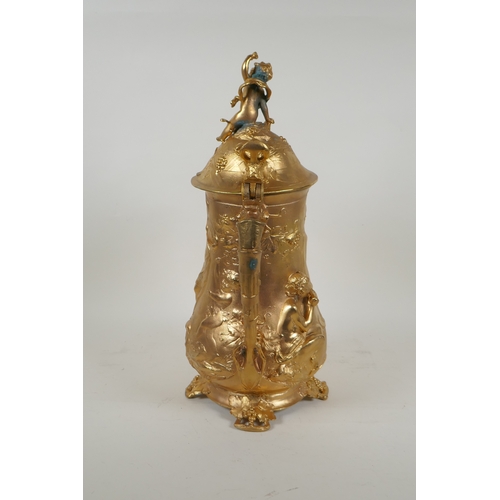 171 - A large secessionist style ormolu tankard decorated with nymphs, putti and fauns, 41cm high