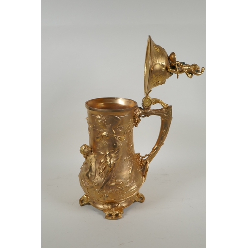 171 - A large secessionist style ormolu tankard decorated with nymphs, putti and fauns, 41cm high