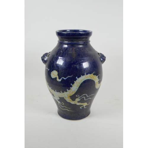 173 - A Chinese blue and white porcelain vase with incised dragon decoration and two mask handles, two cha... 