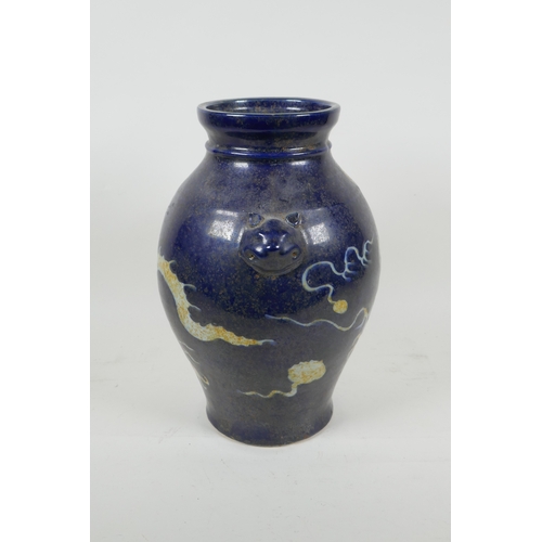 173 - A Chinese blue and white porcelain vase with incised dragon decoration and two mask handles, two cha... 