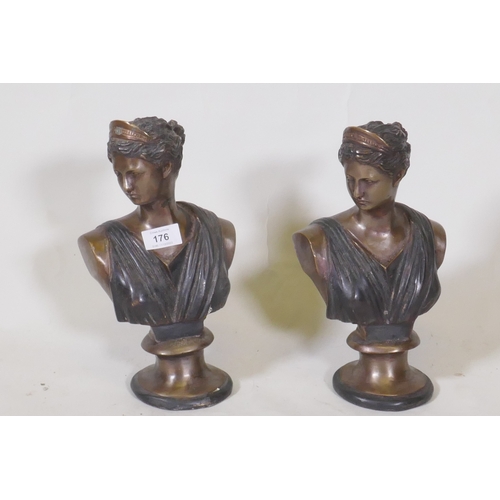 176 - A pair of patinated bronze busts of women in classical attire, 29cm high